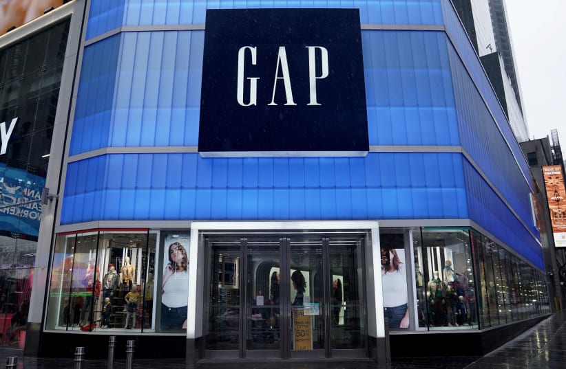 A closed Gap store is pictured in Times Square following the outbreak of Coronavirus disease (COVID-19), in the Manhattan borough of New York City, New York, US, March 23, 2020. (photo credit: REUTERS)