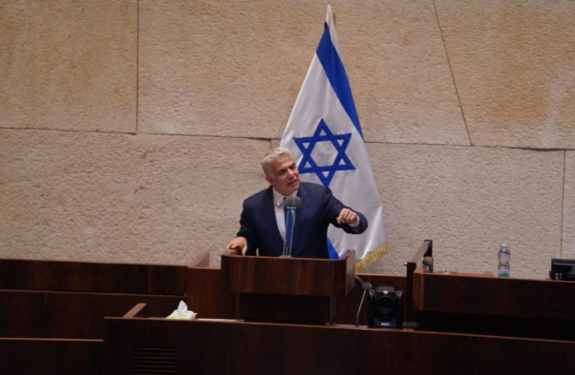 Yesh Atid leader Yair Lapid participates in a discussion on the government formation bill, April 2020. (photo credit: KNESSET SPOKESPERSON'S OFFICE)