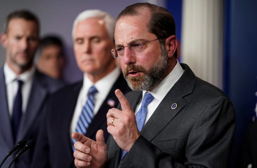 US Secretary of Health and Human Services Alex Azar speaks during a news briefing on the administration's response to the coronavirus at the White House in Washington, March 15, 2020. (photo credit: JOSHUA ROBERTS / REUTERS)