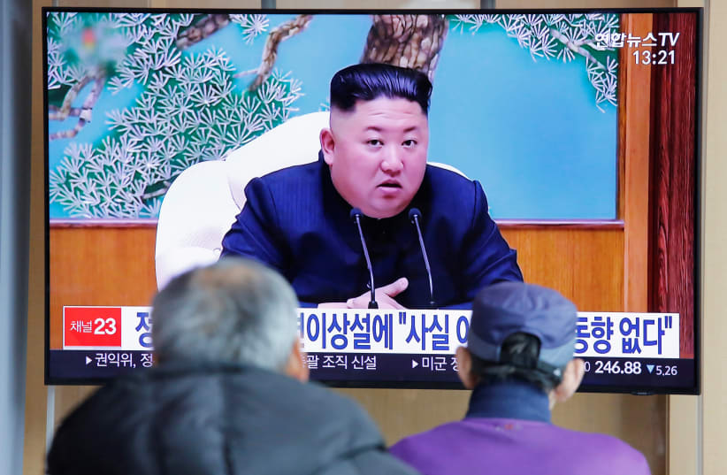 South Korean people watch a TV broadcasting a news report on North Korean leader Kim Jong Un in Seoul, South Korea, April 21, 2020 (photo credit: REUTERS/HEO RAN)