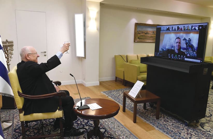 Diaspo President Reuven Rivlin and IDF Chief of Staff Lt.-Gen. Aviv Kochavi host a Zoom call with lone soldiers in Israel and around the world on April 7, instead of hosting them at the President’s Residence as in previous years. (photo credit: MARK NEYMAN/GPO)