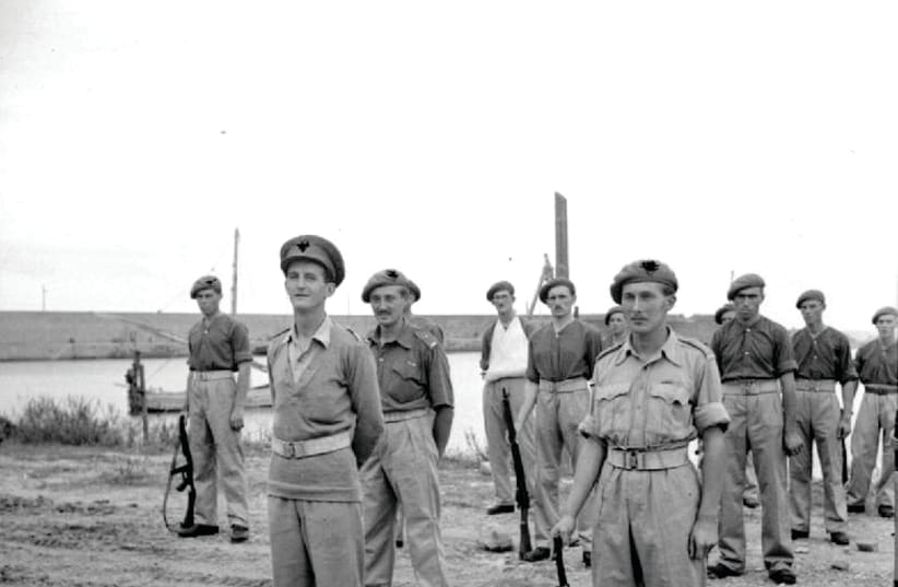 Members of 2 SAS on parade for an inspection by Gen. Montgomery, following their successful participation in the capture, behind enemy lines, of the port of Termoli in Italy. On the left is Maj. E. Scratchley DSO, commanding the SAS detachment, while on the right is Capt. Roy Farran holding a German (photo credit: UK GOVERNMENT/WIKIMEDIA COMMONS)