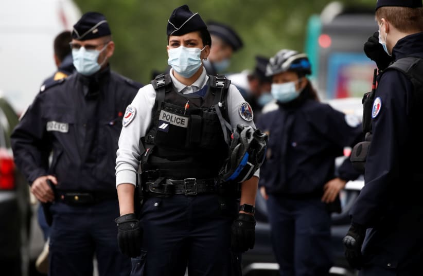 French police officers in Paris, France, April 28, 2020. (photo credit: REUTERS/BENOIT TESSIER)
