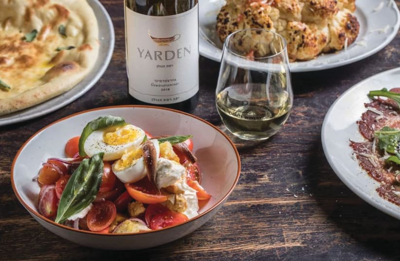 An informal meal is enhanced by a tumbler of vino (photo credit: GOLAN HEIGHTS WINERY)