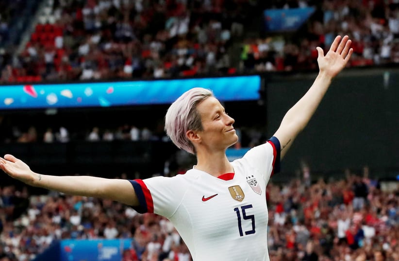 Megan Rapinoe of the U.S. celebrates scoring their first goal during the France v United States game during the Women's World Cup Quarter Final at Parc des Princes, Paris, France June 28, 2019. (photo credit: BENOIT TESSIER /REUTERS)