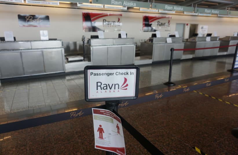 Empty RavnAir ticket counters are seen after the airlines declared bankruptcy, during the outbreak of the coronavirus disease (COVID-19), at Ted Stevens Anchorage International Airport in Alaska, U.S., April 7, 2020. (photo credit: REUTERS/YERETH ROSEN)
