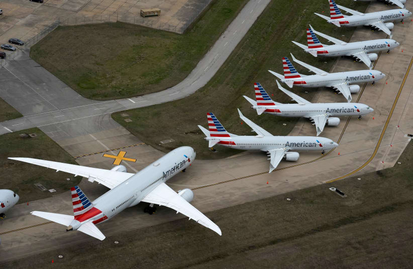American Airlines passenger planeS parked at Tulsa International Airport in Tulsa, Oklahoma, U.S. March 23, 2020 (photo credit: REUTERS/NICK OXFORD/FILE PHOTO)