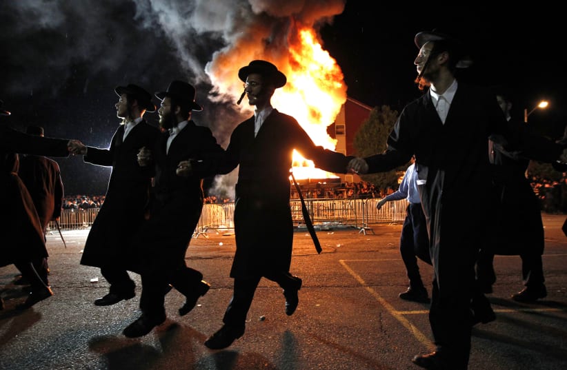 Orthodox Jews of the Satmar Hasidim celebrate Lag BaOmer in the village of Kiryas Joel (photo credit: MIKE SEGAR / REUTERS)