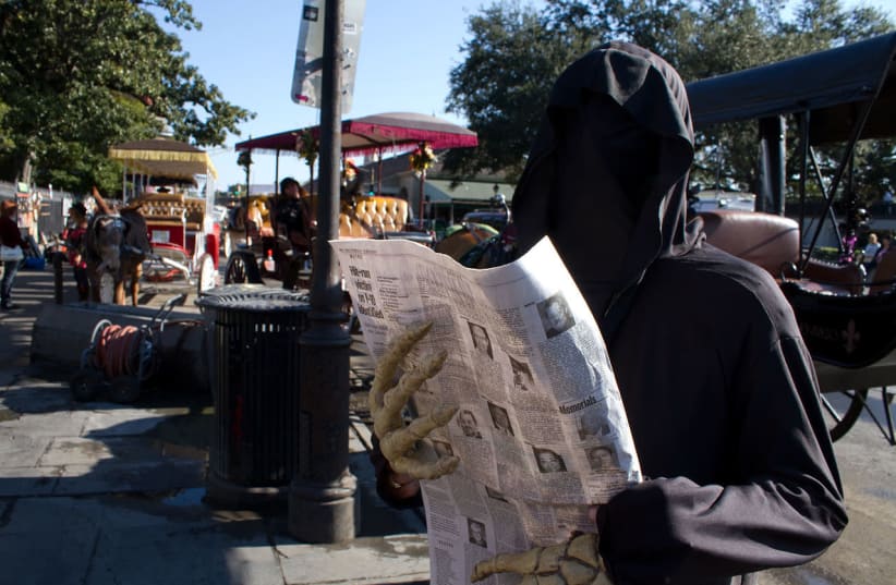 A man dressed as the 'Grim Reaper.' (photo credit: WIKIPEDIA)