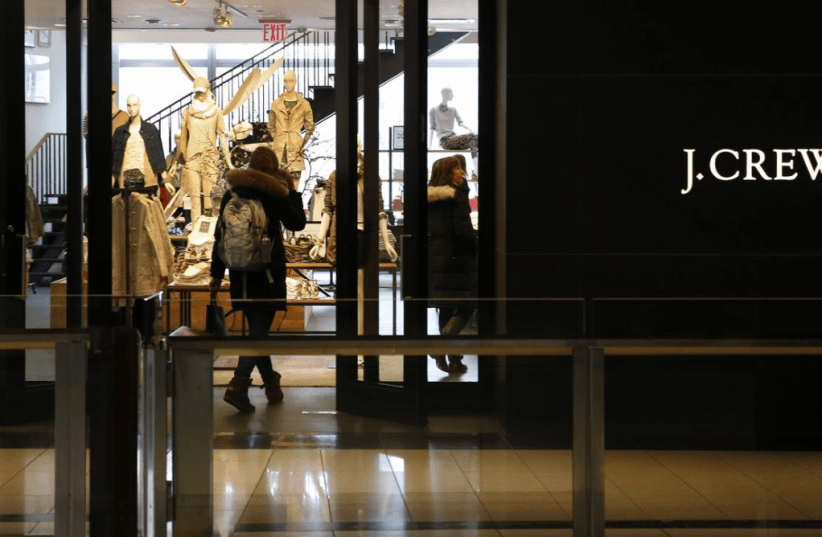 A customer walks into a clothing retailer J.Crew store in Manhattan, New York, March 3, 2014.  (photo credit: REUTERS/MIKE SEGAR)