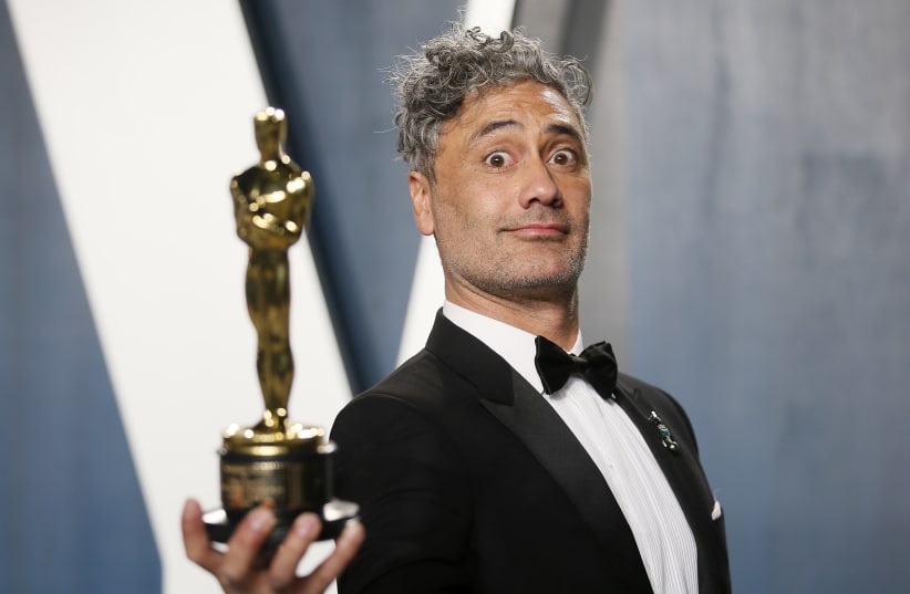 Taika Waititi holds his Oscar for Best Adapted Screenplay for "Jojo Rabbit" during the 92nd Academy Awards, in February. (photo credit: DANNY MOLOSHOK/ REUTERS)