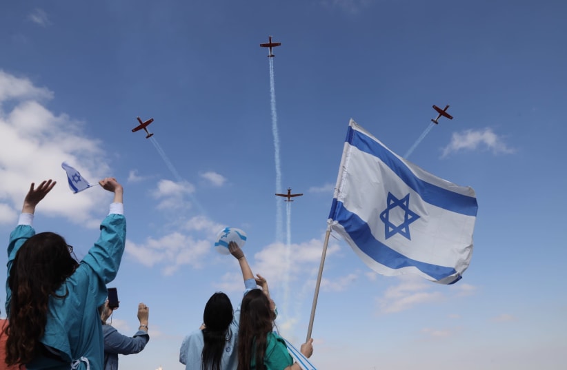 Medical staff at Jerusalem’s Shaare Zedek Medical Center wave at an Israel Air Force flyover on Independence Day (photo credit: MARC ISRAEL SELLEM)
