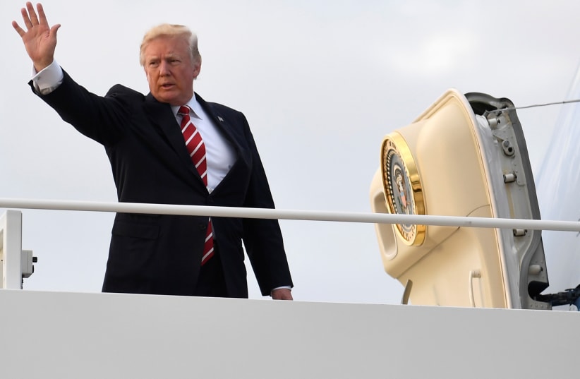 US President Donald Trump heads to a fundraising event at the home of Louis DeJoy. (photo credit: MIKE THEILER/REUTERS)