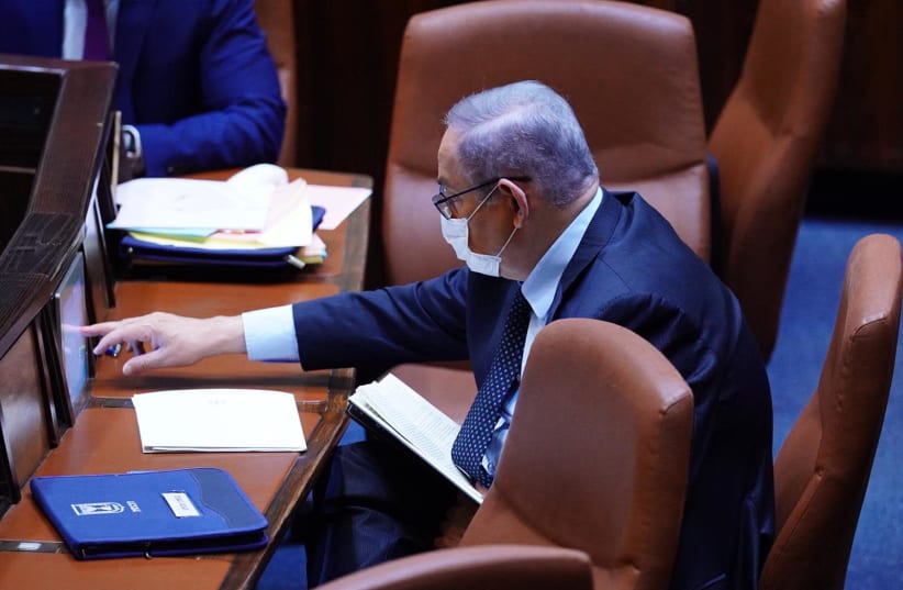 Prime Minister Benjamin Netanyahu, in protective mask, attends the session of the Knesset plenum, May 7, 2020 (photo credit: KNESSET SPOKESWOMAN - ADINA WALLMAN)
