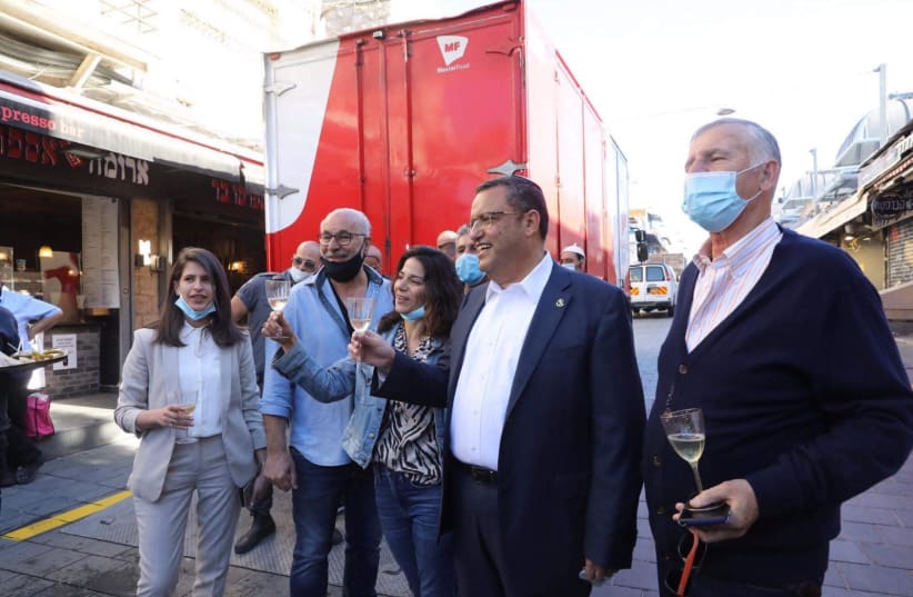 Jerusalem Mayor Moshe Lion celebrates the reopening of the Mahane Yehuda market. (photo credit: MARC ISRAEL SELLEM)
