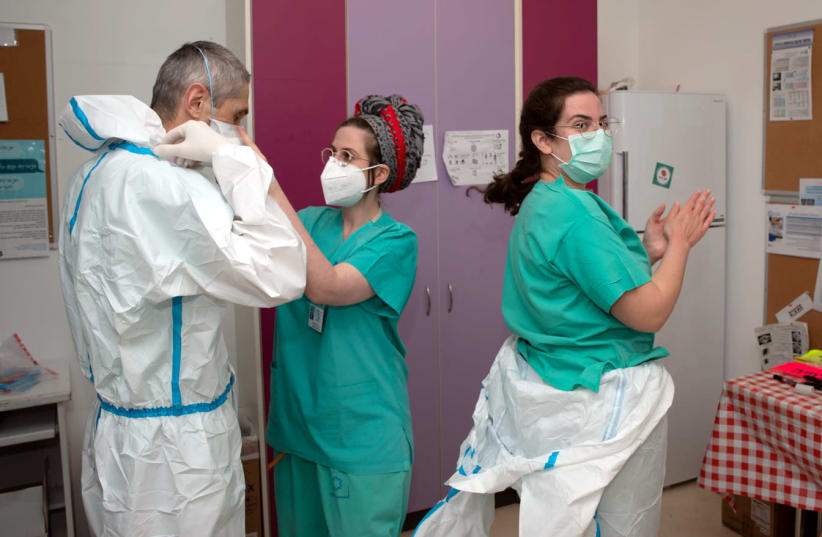 THE HIGHEST standards of personal protective equipment were required for all corona patient interactions (photo credit: TAL CHERES)