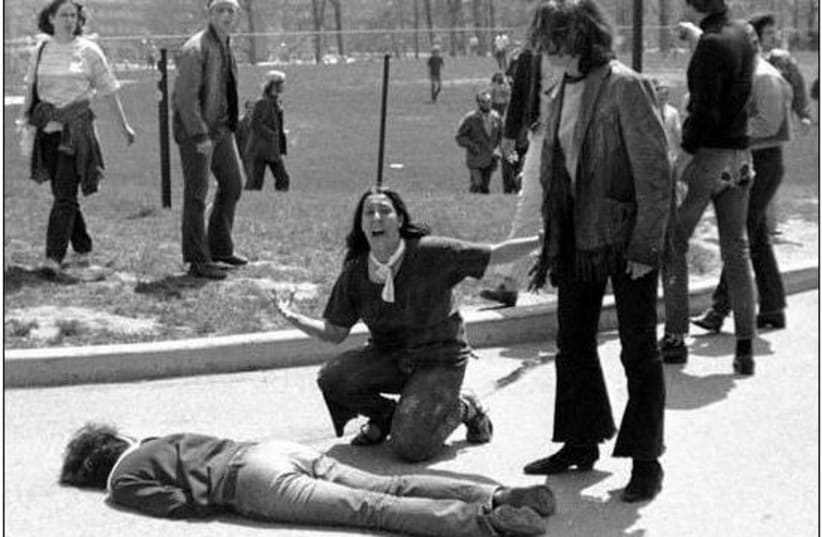 THE PULITZER Prize-winning photo of Mary Ann Vecchio crying out and kneeling over the body of the fatally wounded Jeffrey Miller. (photo credit: CLIFF/FLICKR)