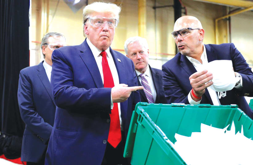 PRESIDENT TRUMP visited a face mask factory in Phoenix, Arizona, on Tuesday but declined to wear a mask. (photo credit: REUTERS)