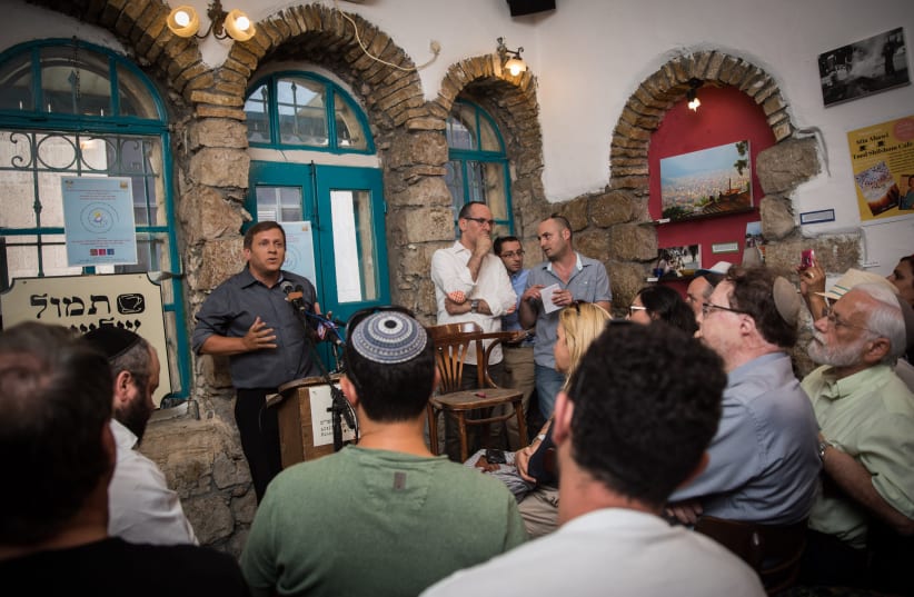 Israeli actor, director, playwright, and acting teacher, Hagai Luber, speaks during an artists' conference in Tmol Shilshom Cafe in Jerusalem (photo credit: HADAS PARUSH/FLASH90)