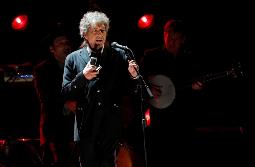 FILE PHOTO: Singer Bob Dylan performs during a segment honoring Director Martin Scorsese, recipient of the Music+ Film Award, at the 17th Annual Critics' Choice Movie Awards in Los Angeles January 12, 2012 (photo credit: REUTERS/MARIO ANZUONI/FILE PHOTO)