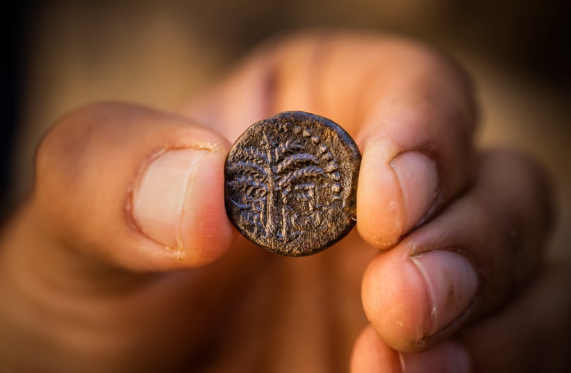 Bar Kokhba Revolt Coin inscribed with the word "Jerusalem" and a picture of a date palm (photo credit: KOBI HARATI/CITY OF DAVID)