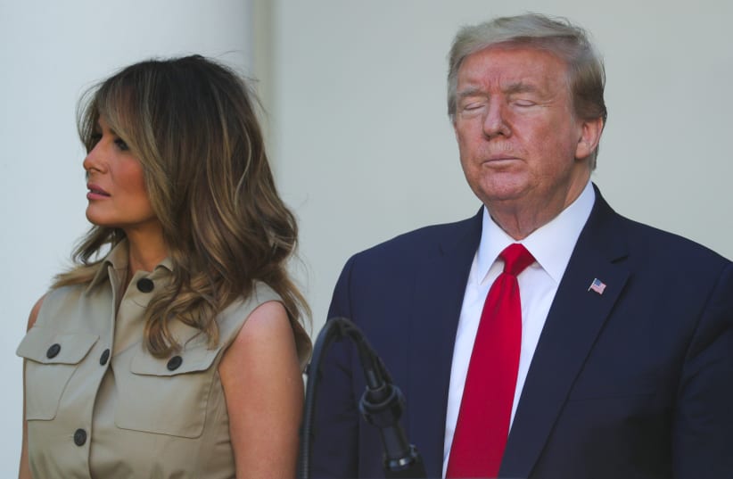 U.S. President Trump stands with first lady during White House National Day of Prayer Service in Rose Garden of White House in Washington (photo credit: REUTERS)