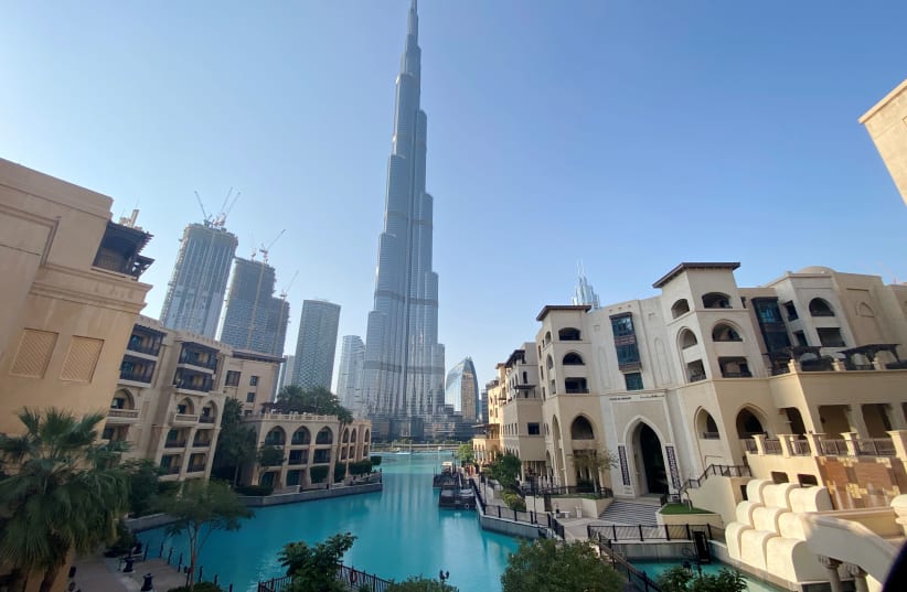 A general view shows the area outside the Burj Khalifa, the world's tallest building, mostly deserted, after a curfew was imposed to prevent the spread of the coronavirus disease (COVID-19), in Dubai, United Arab Emirates March 25, 2020. Picture taken March 25, 2020 (photo credit: REUTERS/TAREK FAHMY)