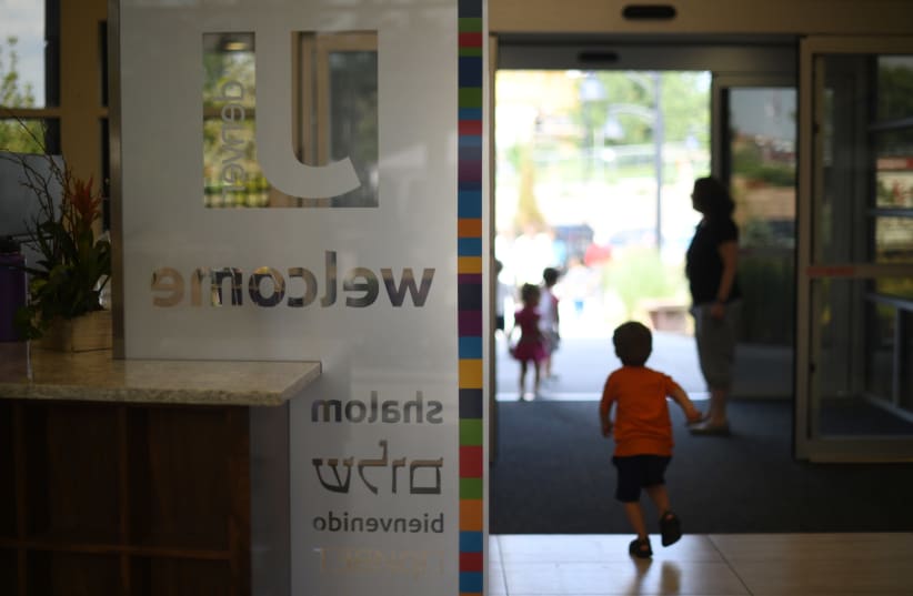 The main entrance of the Staenberg-Loup Jewish Community Center in Denver, photographed in 2018. JCCs are among the establishment institutions prioritized by a $91 million Jewish coronavirus relief fund. (photo credit: HYOUNG CHANG/THE DENVER POST VIA GETTY IMAGES/JTA)
