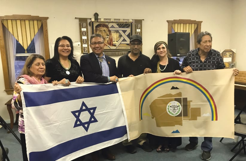 NAVAJO NATION vice president Myron Lizer (third from left), Dine Navajo Nation members and Indigenous Bridges activists including Ateret Violet Shmuel (second from right) hold the Navajo Nation and Israeli flags to demonstrate the desire to collaborate. (photo credit: Courtesy)