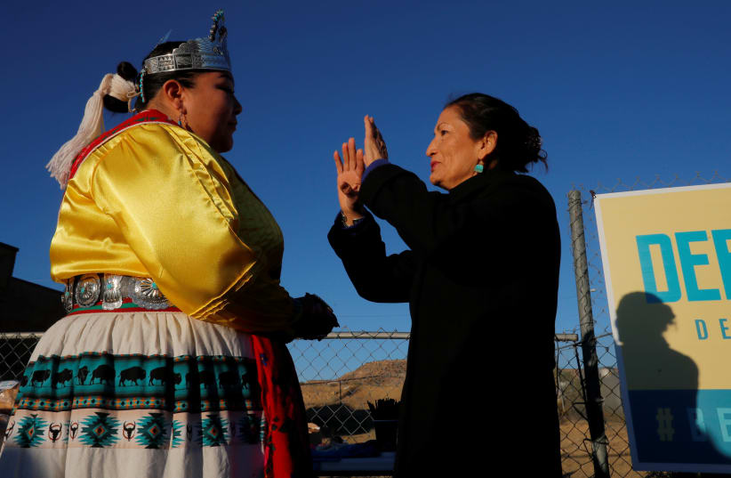 MISS NAVAJO NATION Autumn Montoya talks to Deb Haaland (D-New Mexico), one of the first Native American women in the US House of Representatives, in To’hajiilee Navajo Nation, New Mexico, in 2018. (photo credit: BRIAN SNYDER/REUTERS)