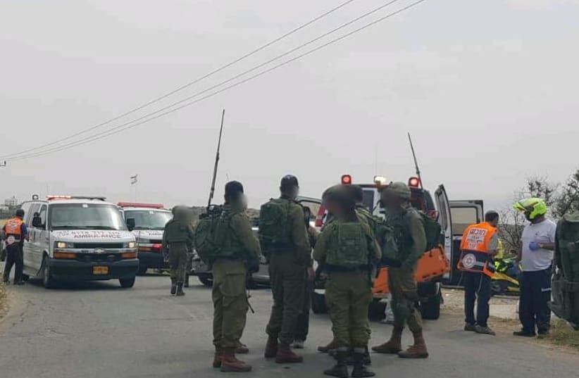 The scene of a suspected car ramming attack near Hebron (photo credit: MAGEN DAVID ADOM OPERATIONAL DOCUMENTATION)