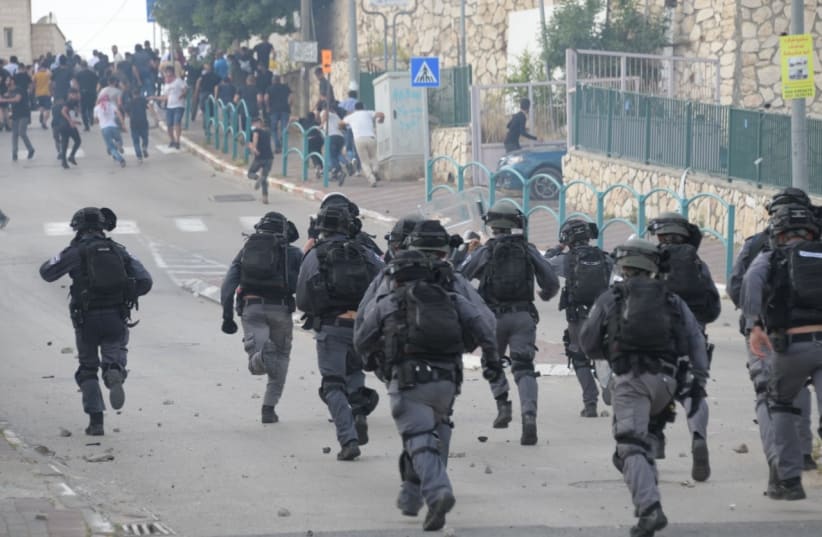 Clashes between police forces and protesters in Wadi Ara (photo credit: POLICE SPOKESPERSON'S UNIT)