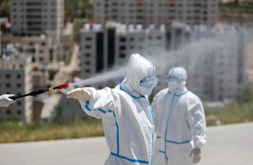 ‘THE SHOCK, trauma and carnage wrought by coronavirus should be cause for introspection and reflection in Israel about many things, foremost, our often tortuous relations with the Palestinians and the PA.’  (photo credit: REUTERS)