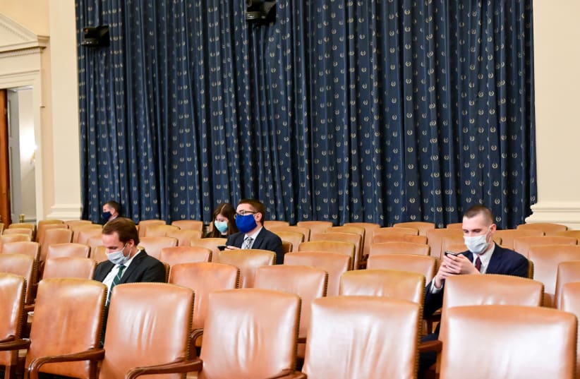 Audience members practice social distancing during a House of Representatives ruling. (photo credit: REUTERS/ERIN SCOTT)