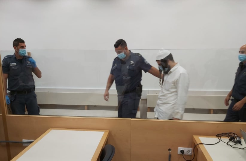Amiram Ben-Uliel appears at Lod District Court ahead of his conviction in the Duma arson case, May 18, 2020 (photo credit: YONAH JEREMY BOB)
