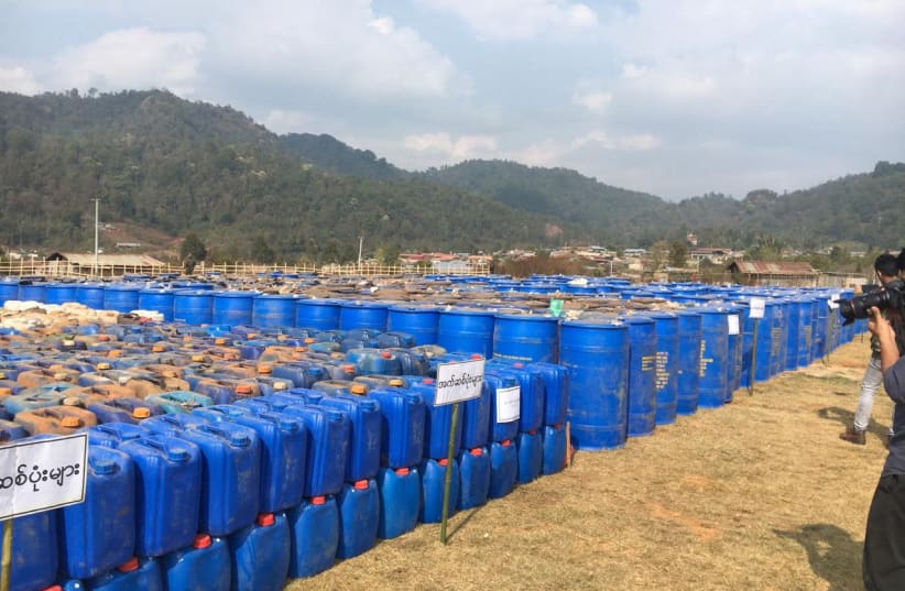 Undated handout photo of precursor chemicals used to make illicit drugs such as methamphetamine, ketamine, heroin and fentanyl seized by Myanmar police and military near Loikan village in Shan State (photo credit: MYANMAR POLICE/UNODC/HANDOUT VIA REUTERS)