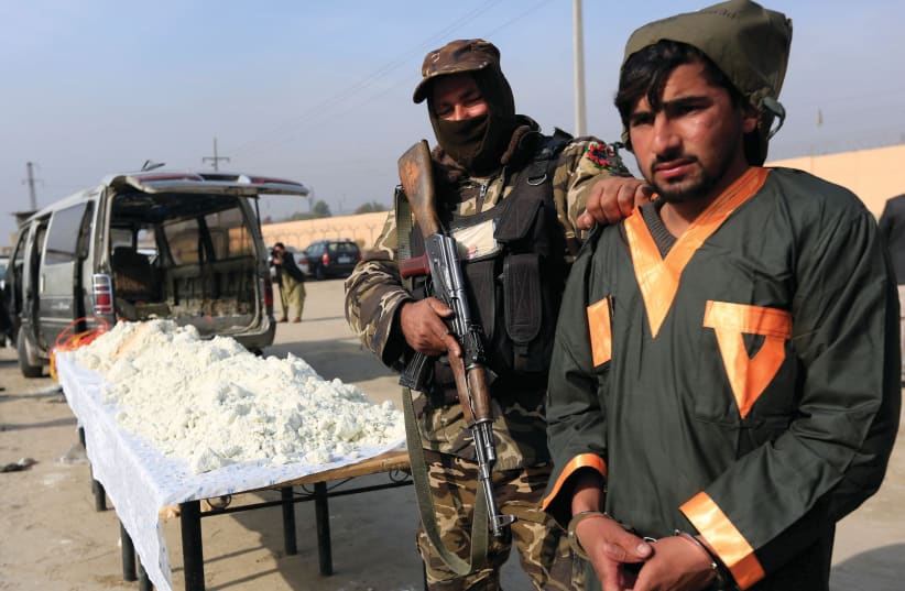 A CAPTURED Taliban insurgent is presented to the media after he was detained with car explosive devices in Jalalabad, Afghanistan, in December 2019 (photo credit: REUTERS/PARWIZ)