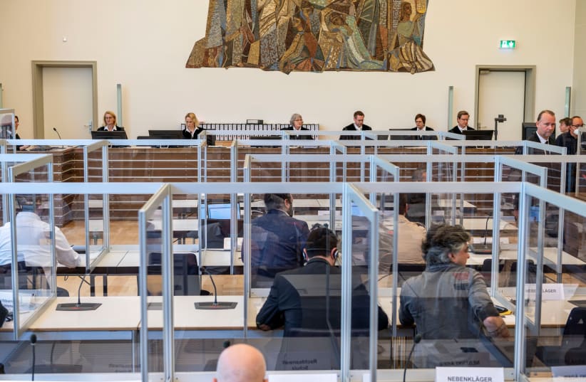 Trial of members of Syrian President Bashar Assad’s security services for crimes against humanity in Germany last month (photo credit: REUTERS/THOMAS LOHNES)