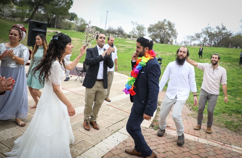 HANANEL EVEN HEN and Shiran Habush celebrate during their corona-era wedding at an Efrat public park on March 15. Jerusalem and its destruction have been remembered at weddings by Jews throughout the world for 2,000 years (photo credit: GERSHON ELINSON/FLASH90)