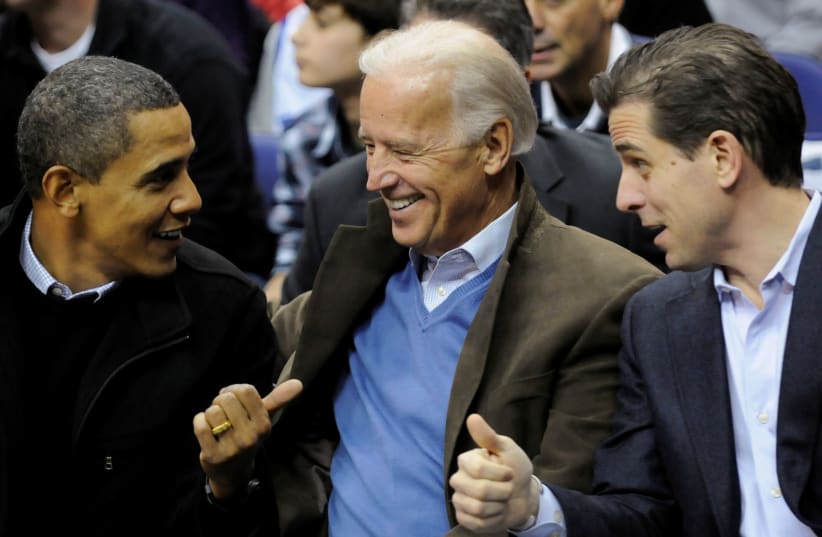 U.S. President Obama, Vice President Biden and his son Hunter attend an NCAA basketball game. January 30, 2010 (photo credit: JONATHAN ERNST / REUTERS)
