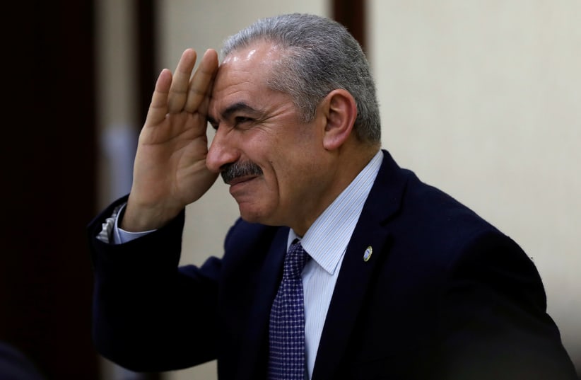 Senior Fatah official Mohammed Shtayyeh gestures during a Palestinian leadership meeting in Ramallah, in the West Bank February 20, 2019 (photo credit: REUTERS/MOHAMAD TOROKMAN)