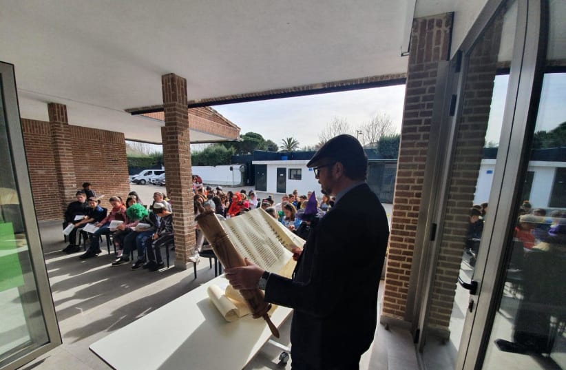 Megilla reading at the Jewish School in Madrid the day before the school closed for the coronavirus (photo credit: COURTESY OF RABBI PIERPAOLO PUNTURELLO)