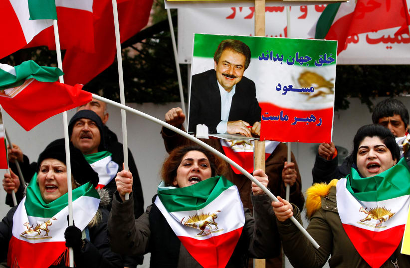 Supporters of the National Council of Resistance of Iran in Germany (NWRI) protest outside Iran's embassy in Berlin, Germany January 3, 2020. (photo credit: REUTERS/MICHELE TANTUSSI)