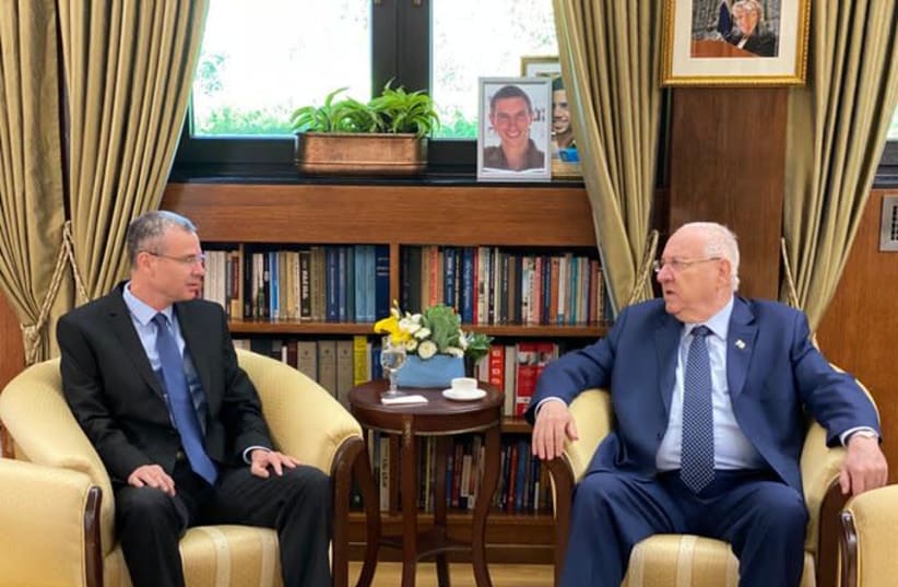 Knesset Speaker Yariv Levin (left) is seen sitting with President Reuven Rivlin. (photo credit: MARK NEYMAN/GPO)
