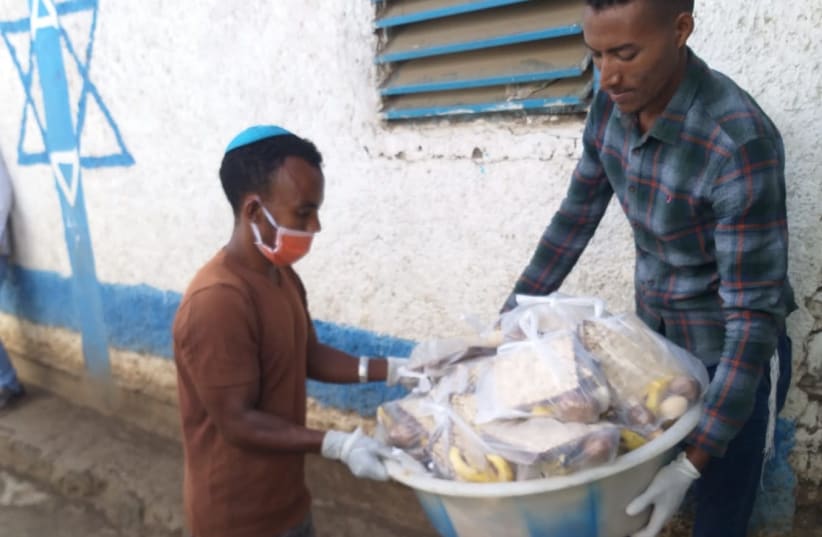 HALF A ton of matzah was flown from Israel to Ethiopia in time for Passover, distributed along with soap and masks (photo credit: Courtesy)
