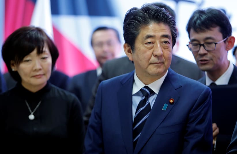 Japan's Prime Minister Shinzo Abe and his wife Akie Abe visit the Jericho Agro Industrial Park, May 2, 2018.  (photo credit: MUSSA QAWASMA/REUTERS)