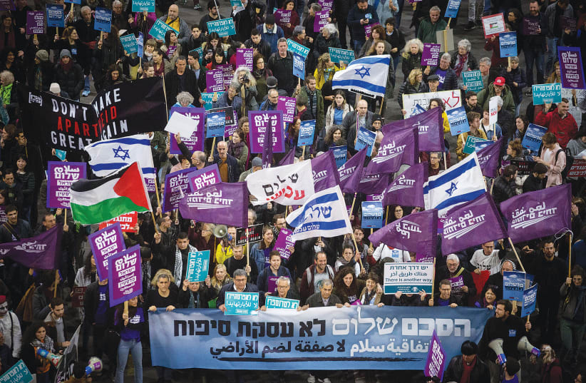 LEFT-WING ACTIVISTS demonstrate against US President Donald Trump’s Middle East peace plan, in Tel Aviv last February. (photo credit: MIRIAM ALSTER/FLASH90)