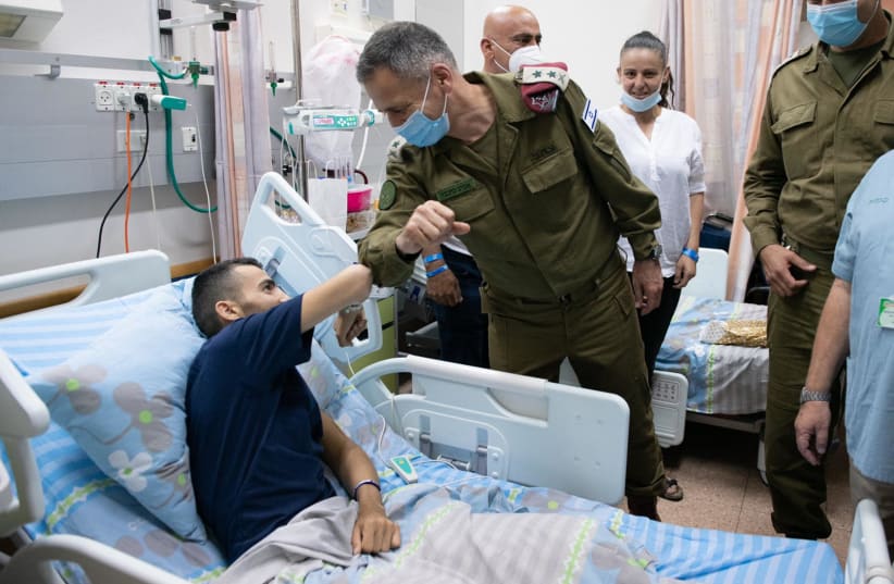 St.-Sgt. Shadi Ibrahim (L) bumping elbows with IDF Chief of Staff Aviv Kochavi (R) (photo credit: IDF SPOKESPERSON'S UNIT)