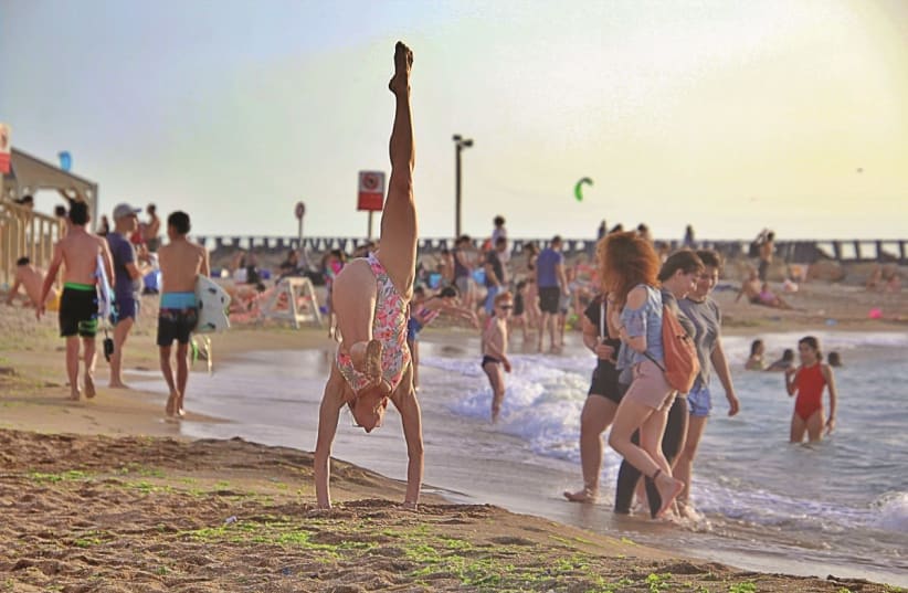 It’s handstanding room only at Israel's beaches. (Deborah Strauss) (photo credit: Courtesy)