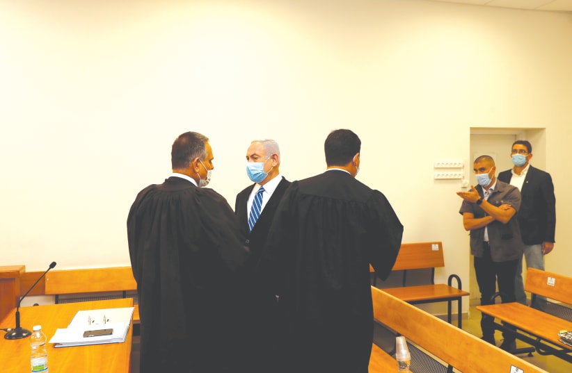 PRIME MINISTER Benjamin Netanyahu at his trial. (photo credit: REUTERS)